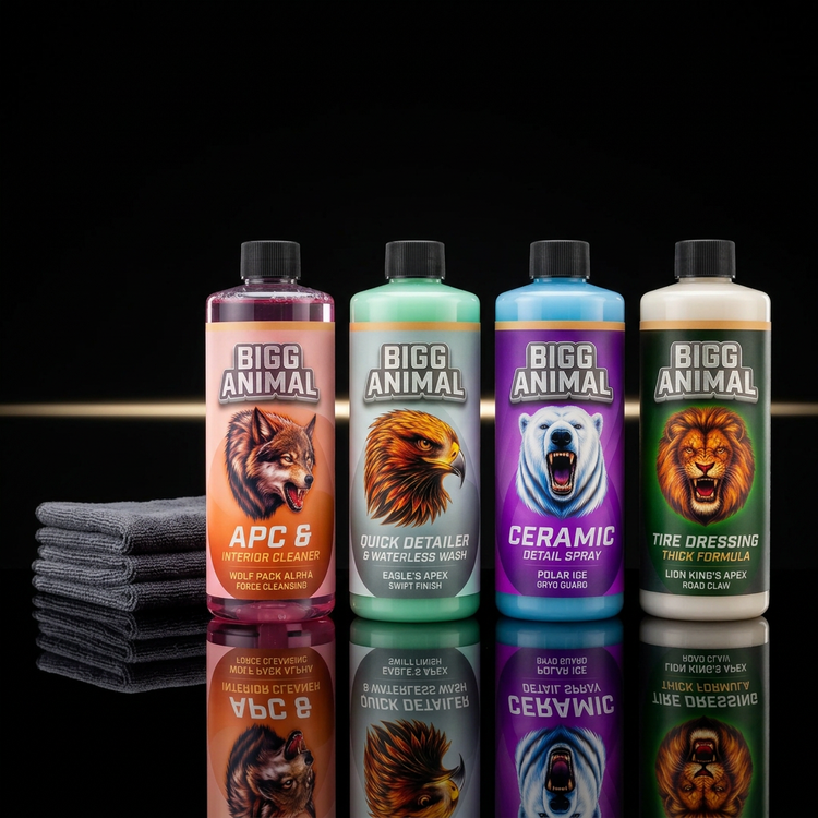 The BIGG ANIMAL Core 4 bottles on a black showroom surface with a gold light streak